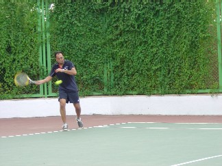  Some took it a little more serious than others. Raj gets a sweat on powering the ball around the court.